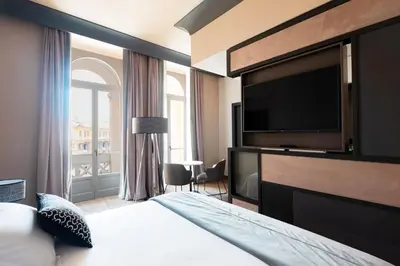 Letto o letti in una camera di Amadomus Luxury Suites
