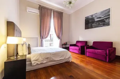 Letto o letti in una camera di Gramsci Suites