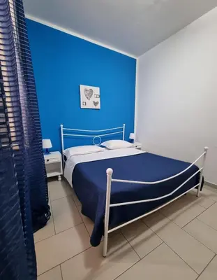 Letto o letti in una camera di Terrazza del Santo 2,0 - La Terrazza nel cuore di Napoli