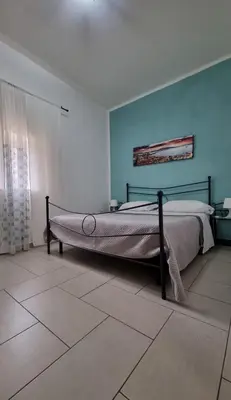 Letto o letti in una camera di Terrazza del Santo 2,0 - La Terrazza nel cuore di Napoli