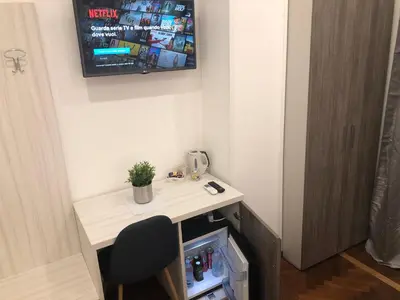 TV o dispositivi per l'intrattenimento presso Hall inn B&B in Naples