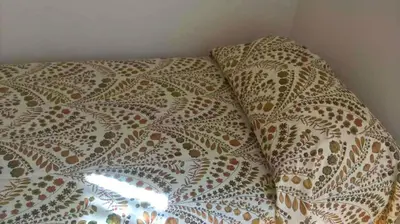 Letto o letti in una camera di L'Atelier Vedi Napoli ai tuoi piedi