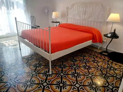 Letto o letti in una camera di L'Atelier Vedi Napoli ai tuoi piedi