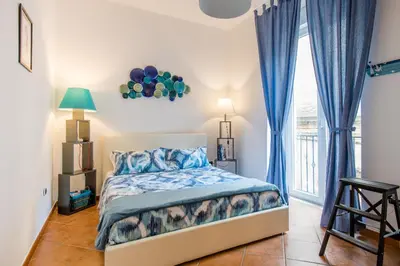 Letto o letti in una camera di Il Posto Fisso Napoli Plebiscito Chiaia
