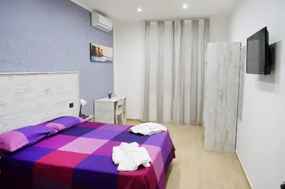 Letto o letti in una camera di b&b annunziata dream