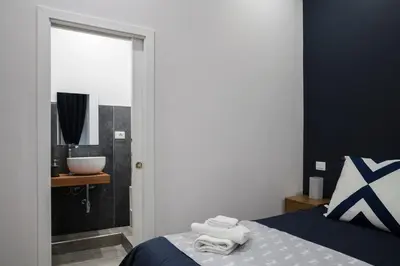 Letto o letti in una camera di Sant'Alfonso Bed and Breakfast Napoli