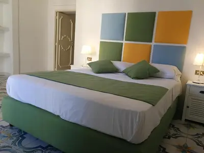Letto o letti in una camera di SuiteNapoliSantaLucia