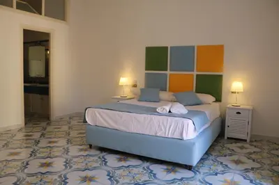 Letto o letti in una camera di SuiteNapoliSantaLucia