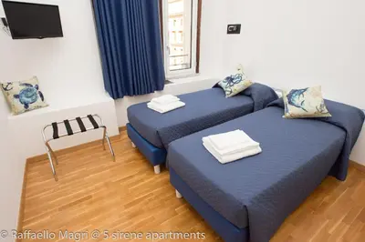 Letto o letti in una camera di 5 sirene