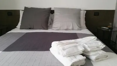 Letto o letti in una camera di Centro Storico - Fermata MONTESANTO