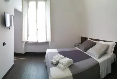 Letto o letti in una camera di Centro Storico - Fermata MONTESANTO