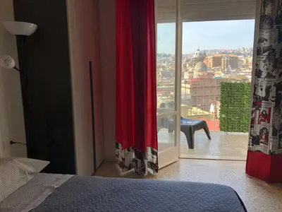 Letto o letti in una camera di Ottieri Apartment Napoli Room&Kitchen with Panoramic View
