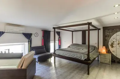 Letto o letti in una camera di luxury suite San Carlo