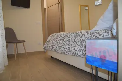 Letto o letti in una camera di Domus Campanile