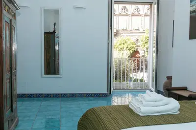 Letto o letti in una camera di Sebeto Bellini