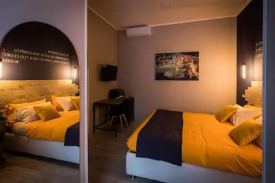 Letto o letti in una camera di B&B i Maestri