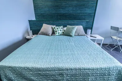 Letto o letti in una camera di Il Grattacielo b&b
