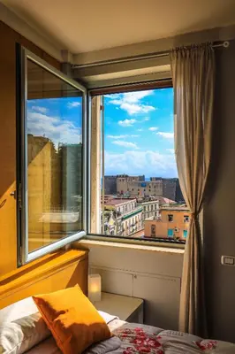 Letto o letti in una camera di Il Grattacielo b&b