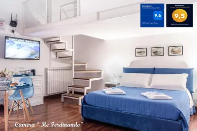 Letto o letti in una camera di B&B Relais Napoli Reale