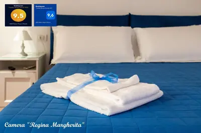 Letto o letti in una camera di B&B Relais Napoli Reale
