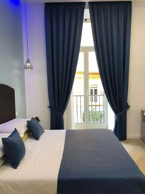Letto o letti in una camera di DOMO B&B