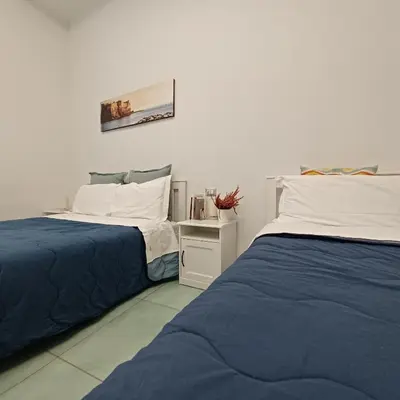 Letto o letti in una camera di Casa Sassolini