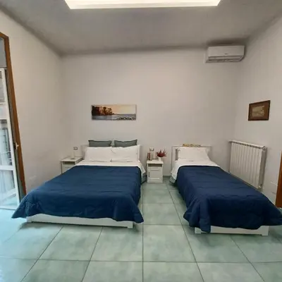 Letto o letti in una camera di Casa Sassolini
