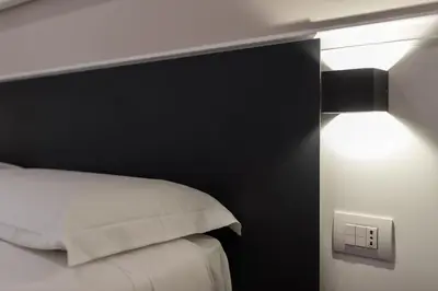 Letto o letti in una camera di Five Boutique Rooms