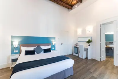 Letto o letti in una camera di Foro Carolino S&B