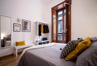 Letto o letti in una camera di Casa Frangiò Modern Apartment Historical Centre - Authentic Neapolitan Apartment for Families and Friends