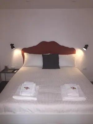 Letto o letti in una camera di CosyHomeSuite Napoli