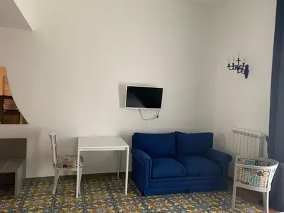 TV o dispositivi per l'intrattenimento presso Specchio di Parthenope B&B