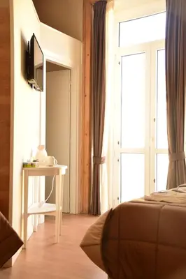 TV o dispositivi per l'intrattenimento presso BelloBello Rooms&Apartment