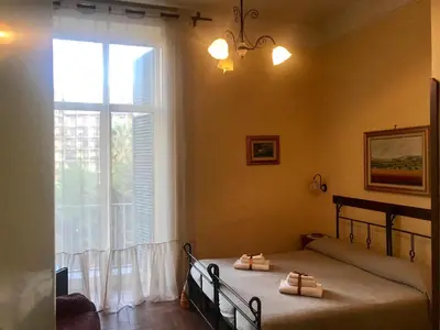 Letto o letti in una camera di B&B Conte Cavour