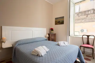 Letto o letti in una camera di B&B Supportico Lopez