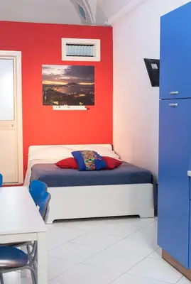 Letto o letti in una camera di Bobbò house II, la finestra sugli scavi