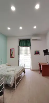Letto o letti in una camera di Casa vacanze Napoli Centro Carmen & Sara