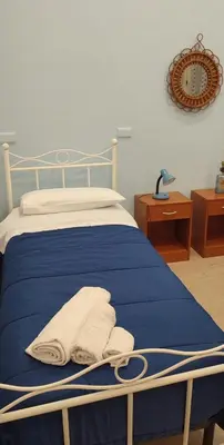 Letto o letti in una camera di Casa vacanze Napoli Centro Carmen & Sara