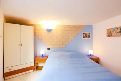 Letto o letti in una camera di La casa di Zucca sopra piazza Plebiscito!