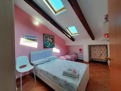 Letto o letti in una camera di Bed & Breakfast La Mansarda