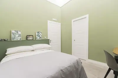 Letto o letti in una camera di Bellini Suite