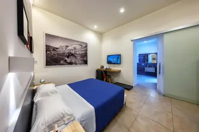 TV o dispositivi per l'intrattenimento presso Napoli Squares Suites