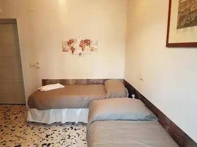 Letto o letti in una camera di Agorà Mura Greche B&b