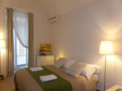 Letto o letti in una camera di iBed Napoli B&B