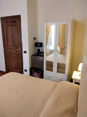 Letto o letti in una camera di Dante Rooms