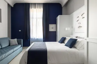 Letto o letti in una camera di My Lodge Italy Centro Storico