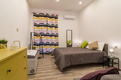 Letto o letti in una camera di Giù al Centro