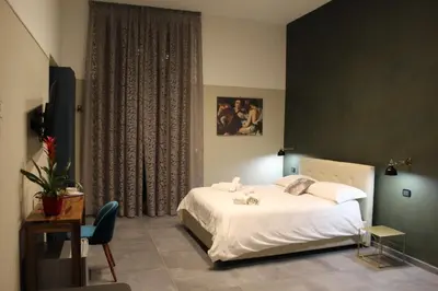 Letto o letti in una camera di Donna Lena Relais Napoli