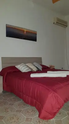 Letto o letti in una camera di B&B Belvedere
