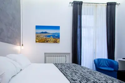 Letto o letti in una camera di Casa Nora Napoli